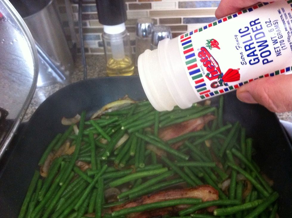 Sprinkle a little bit of garlic powder on the beans. Stir it in.