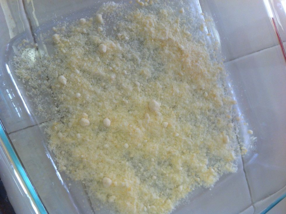 Sprinkle a little extra Parmesean in baking dish with a little oil (about 2 Tbsp) drizzled over