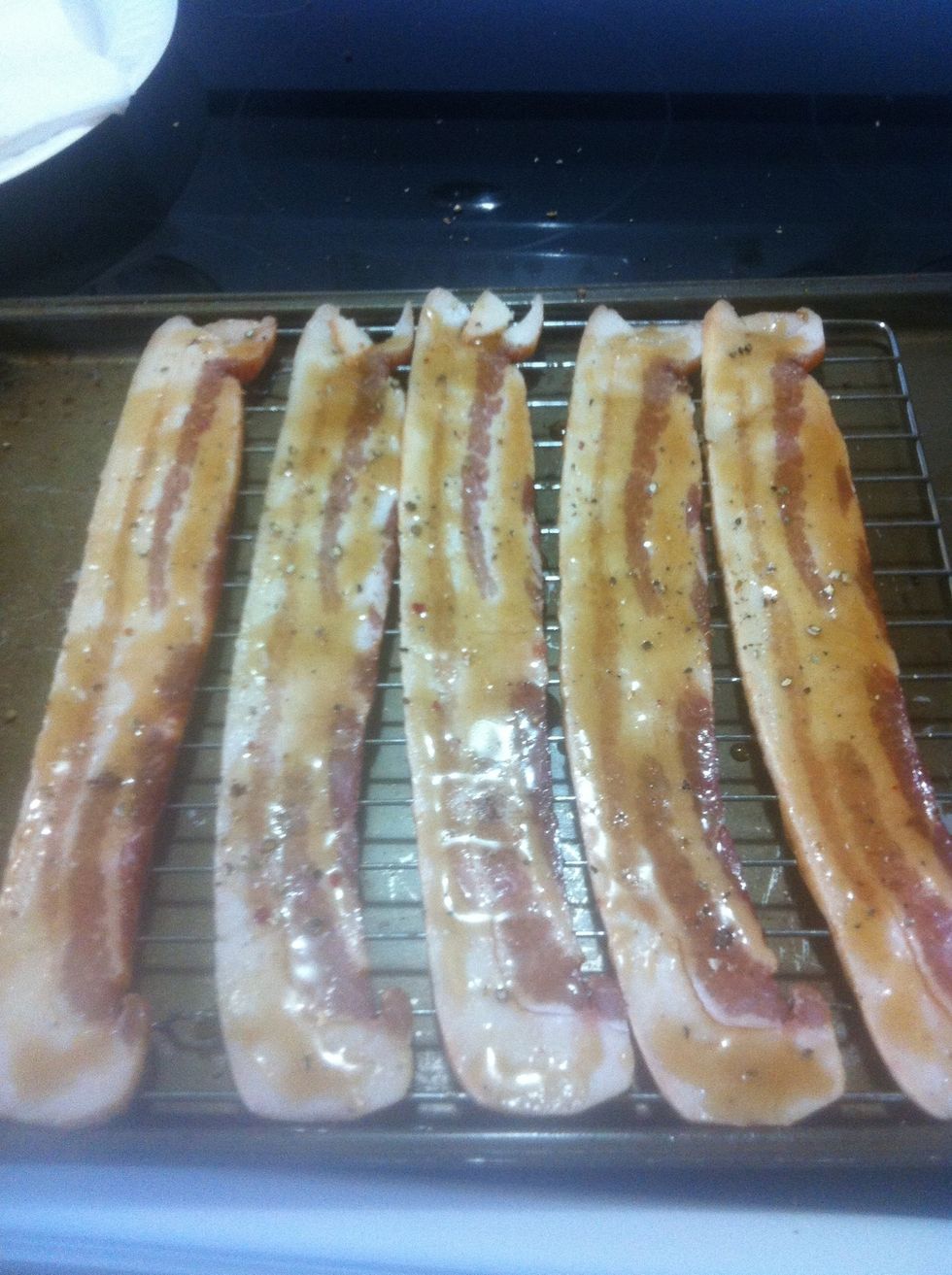 Sprinkle a little more pepper on top and flip the bacon repeat on the other side