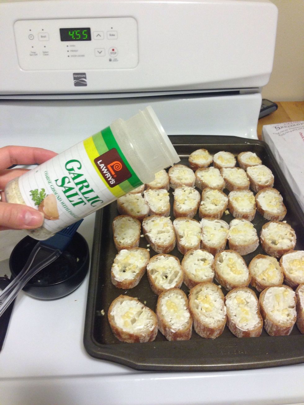 Sprinkle a pinch of garlic salt over the slices. I used about 1/2 tsp per baguette.