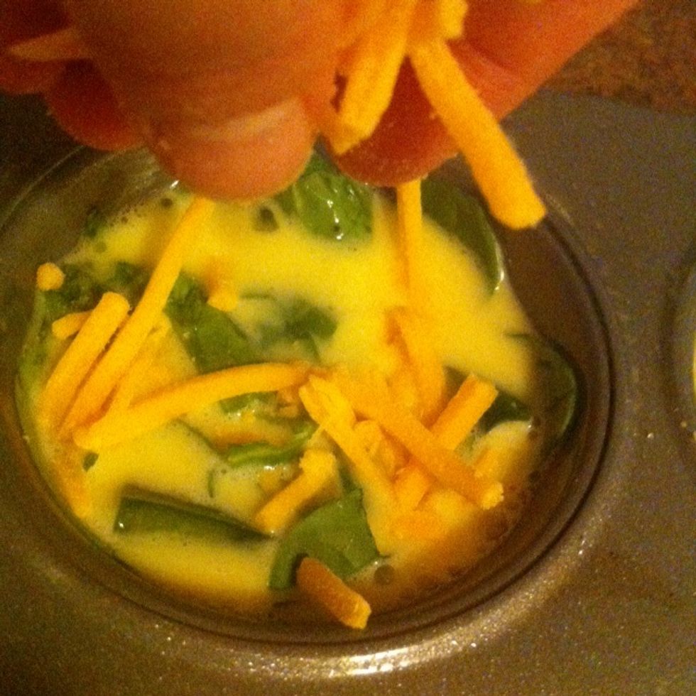 Sprinkle a touch of cheese on top of egg mixture and spinach. You can add as much cheese as you want. OR don't add cheese at all.