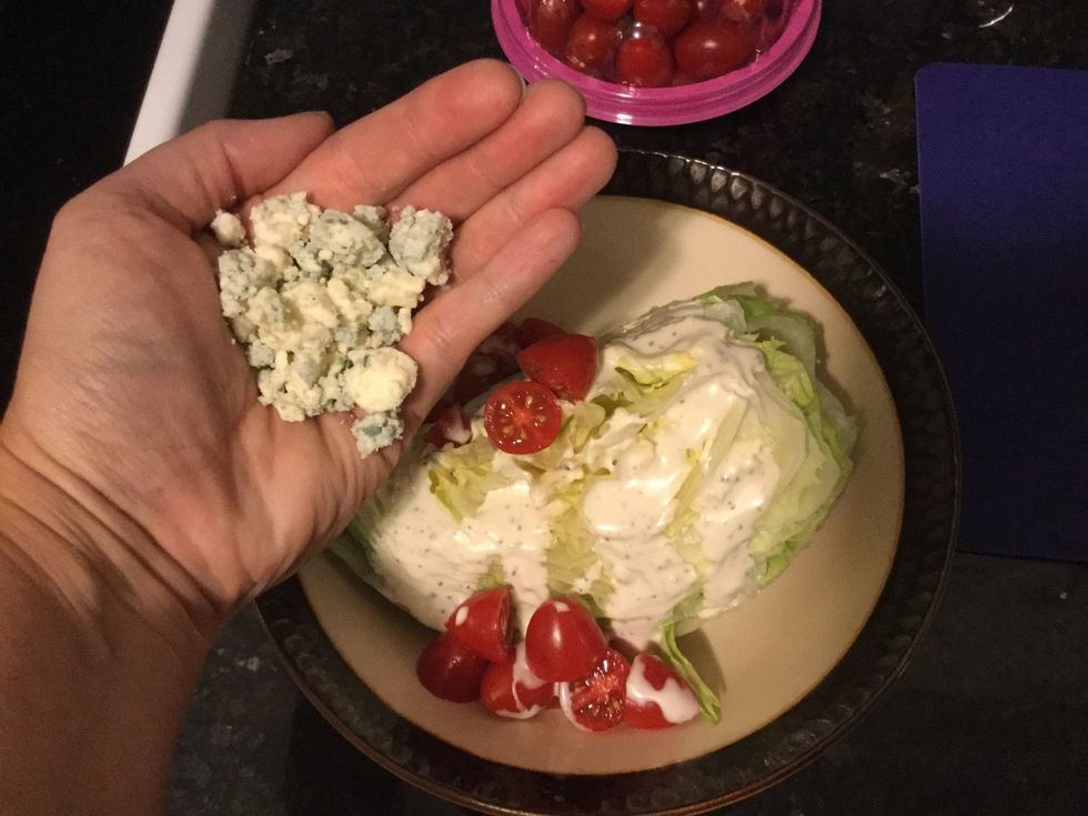 Sprinkle about a handful, or 3 Tbs, of blue cheese crumbles on top of the wedge and tomatoes. Pro tip: use more or less cheese depending on your preference