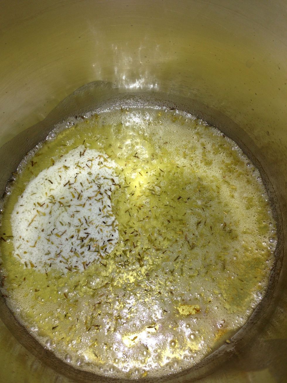 Sprinkle about a tablespoon of thyme into the butter oil mixture. Cook over medium high heat for  one to two minutes. Don't burn the butter.