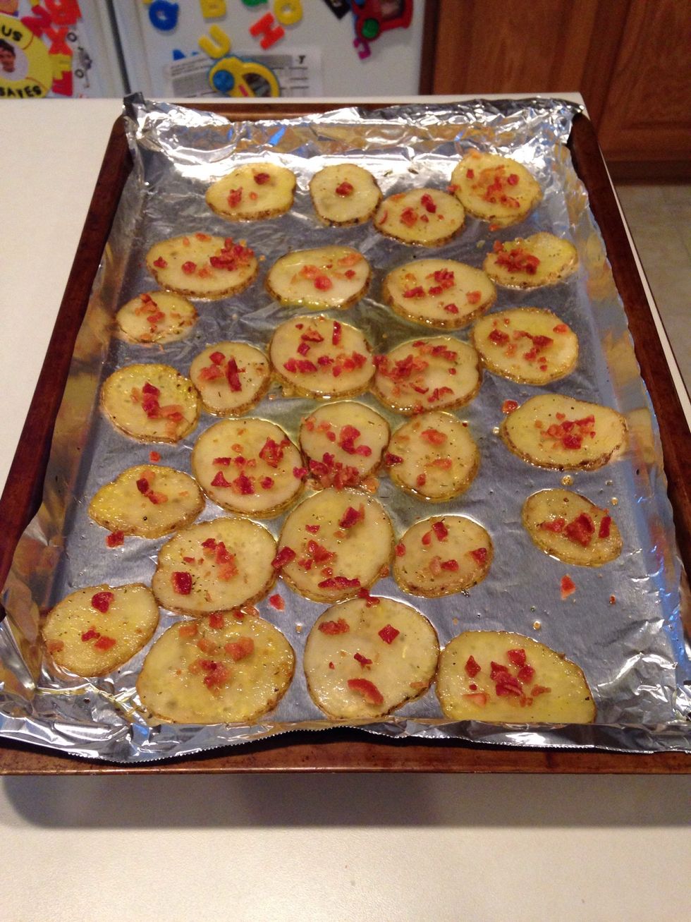 Sprinkle bacon on top of potatoes. You can add cheese, too, just don't let it burn. (This step is optional). Return to oven and bake another 10-15 min or until edges of potatoes start to brown.
