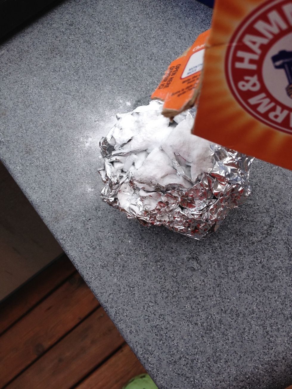 Sprinkle baking soda on the ball