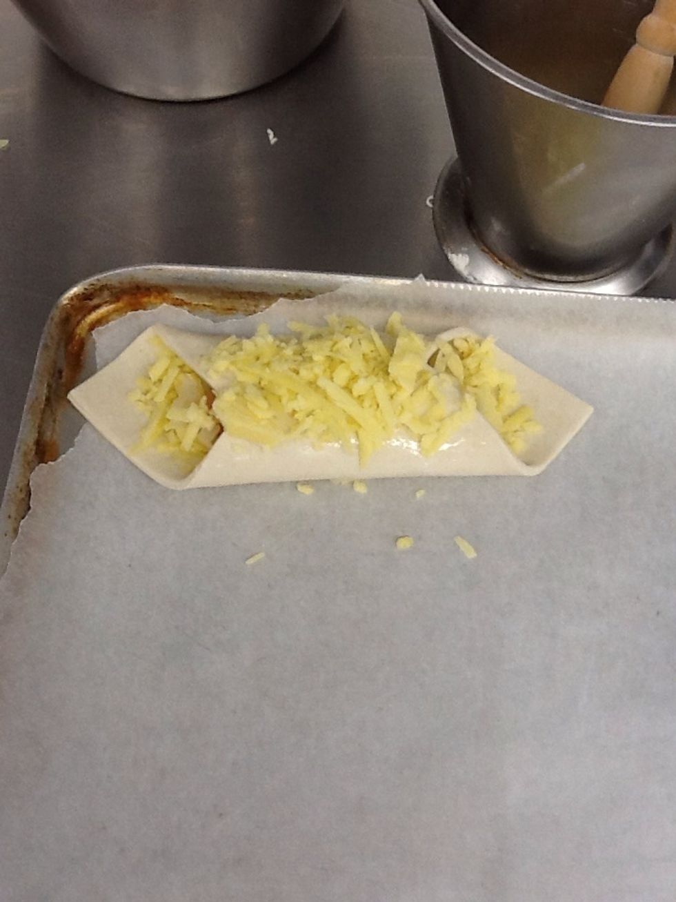 Sprinkle cheese over the top of the turnover.