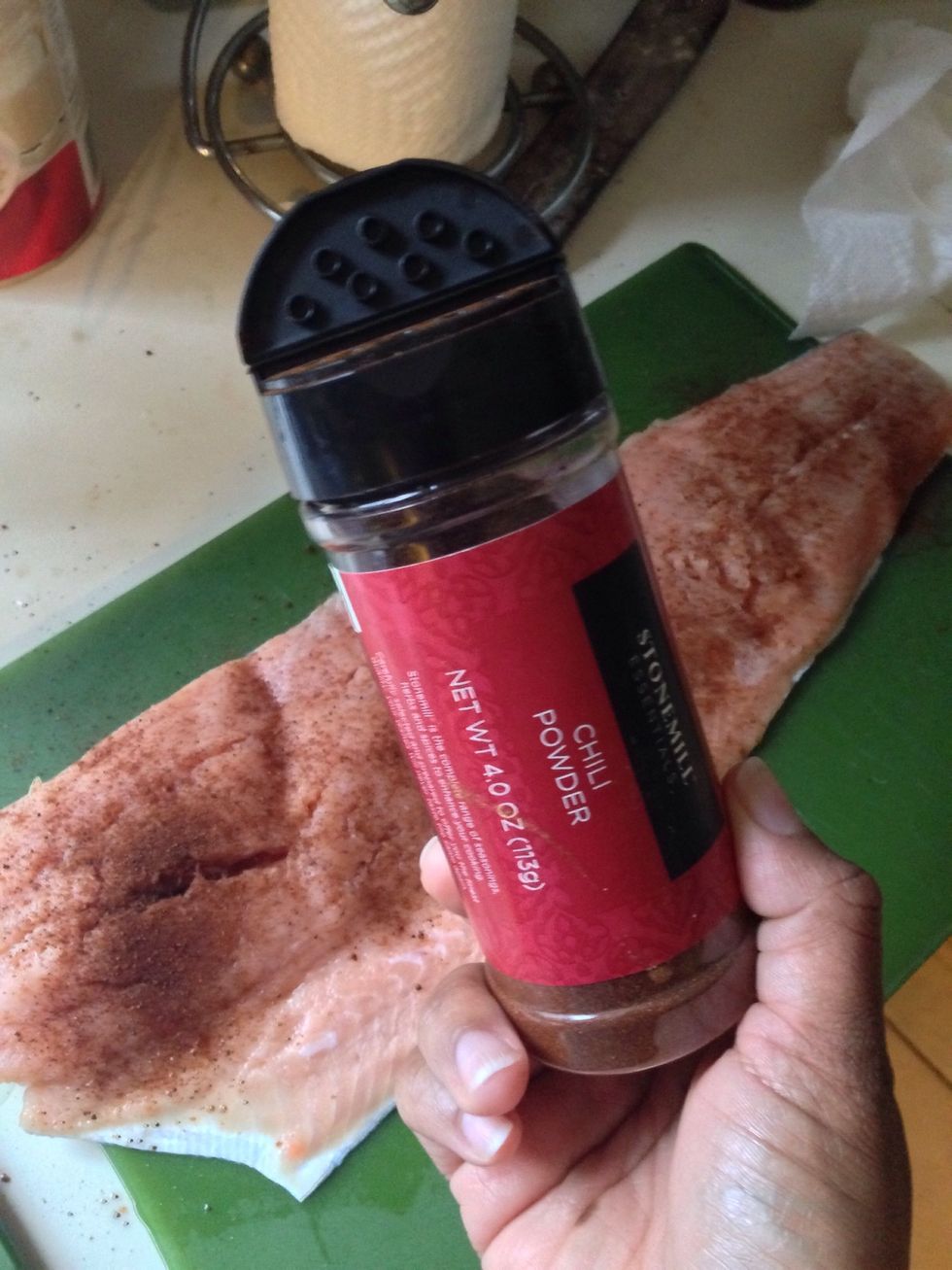 Sprinkle Chili powder all over the Salmon! Use as much as you like no more than a tablespoon