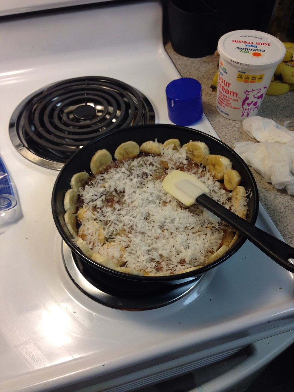 Sprinkle coconut over brown sugar sauce.