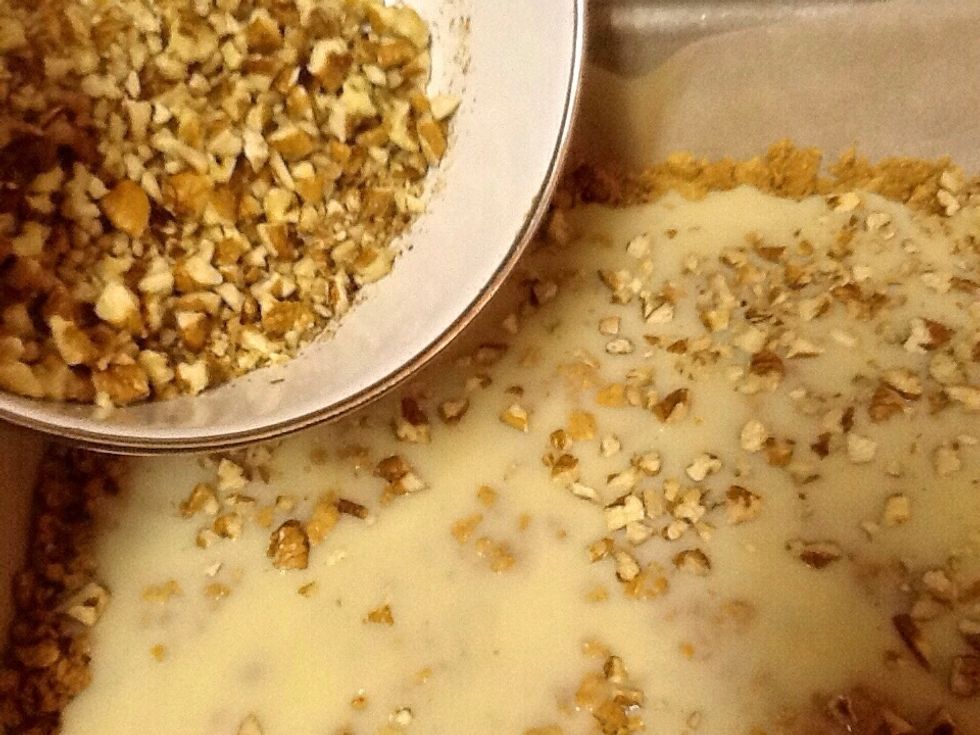 Sprinkle crushed nuts over milk.