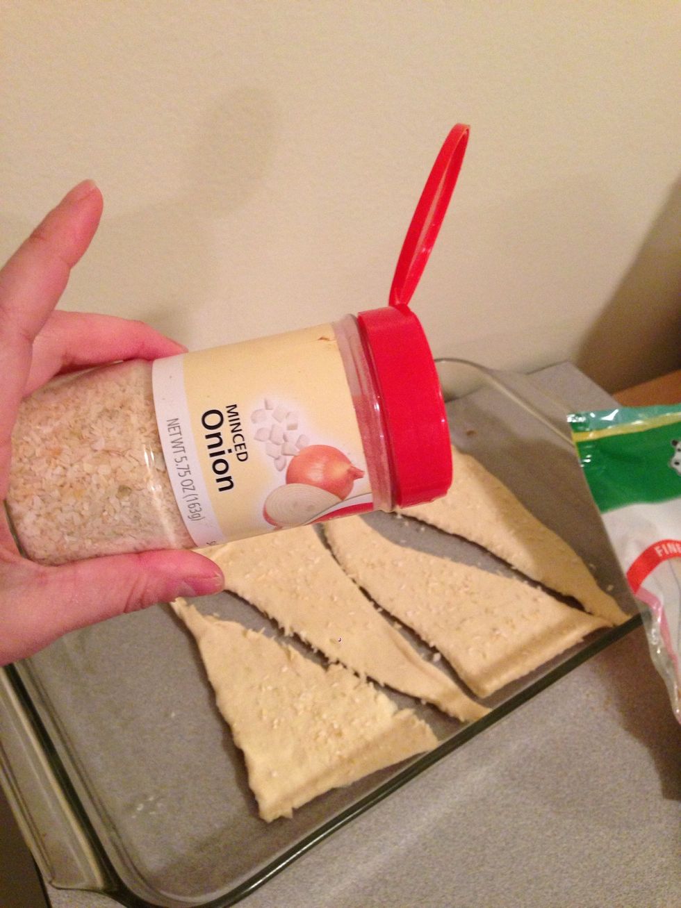 Sprinkle desired amount of minced onion on the base.