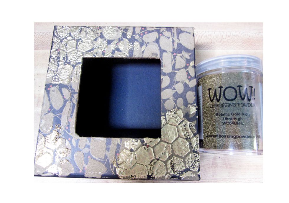 Sprinkle embossing powder over the inked areas and heat set with a heat gun. You can see the section of the bright gold popping out. We are just creating layers and layers for interest.