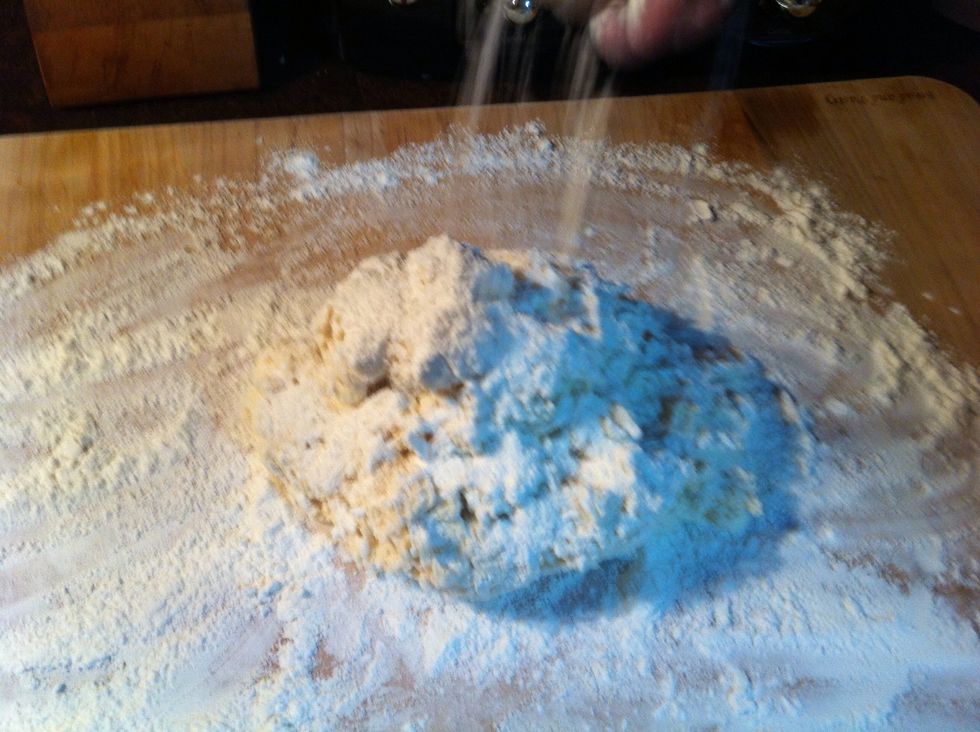 Sprinkle enough of all purpose flour on top to keep your hands from sticking to dough.