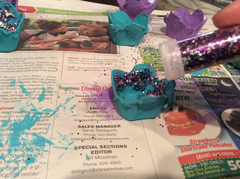 Sprinkle glitter all over the glue so the glitter sticks then let them sit and dry