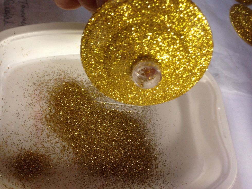 Sprinkle glitter over mod podge.