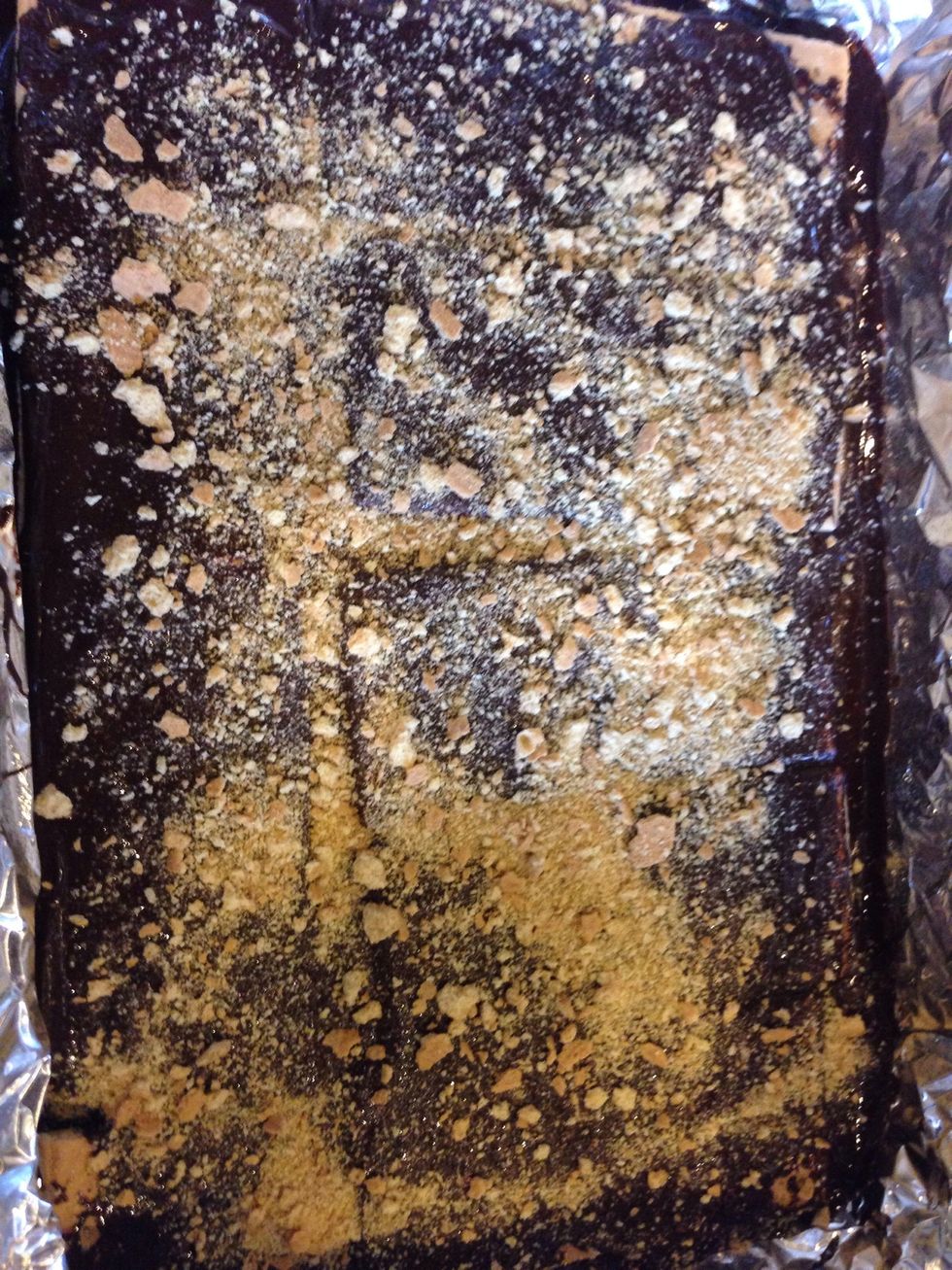 Sprinkle graham cracker crumbs on chocolate.