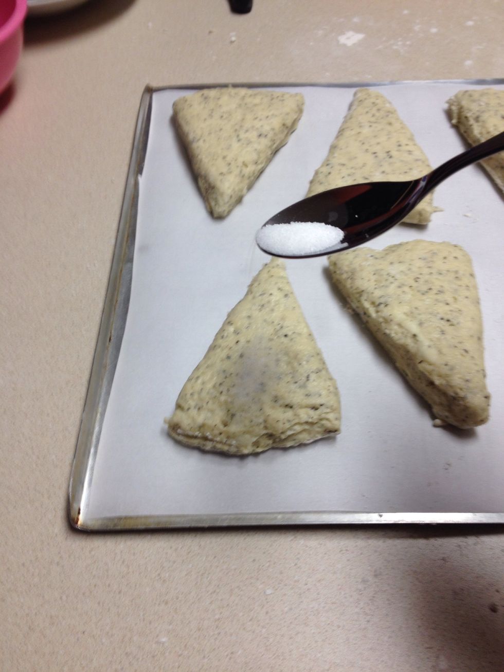 Sprinkle granulated sugar on top of the scones