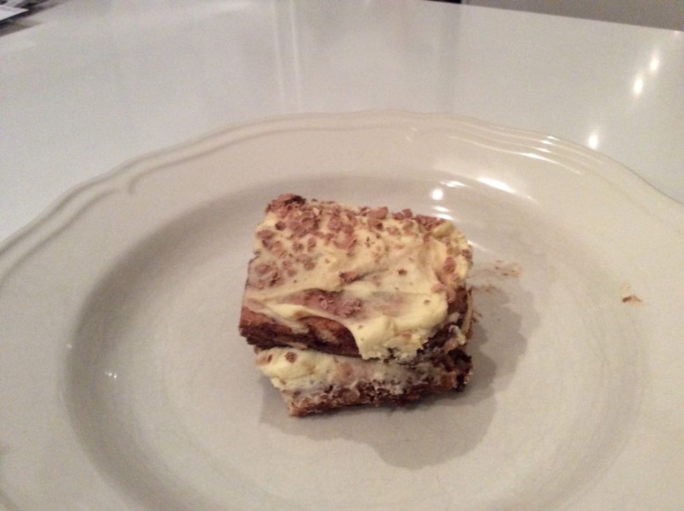 Sprinkle grated chocolate over the top, cover with plastic wrap and refrigerate for at least 3 hours, preferably overnight. slice into squares or spoon out onto plates to serve