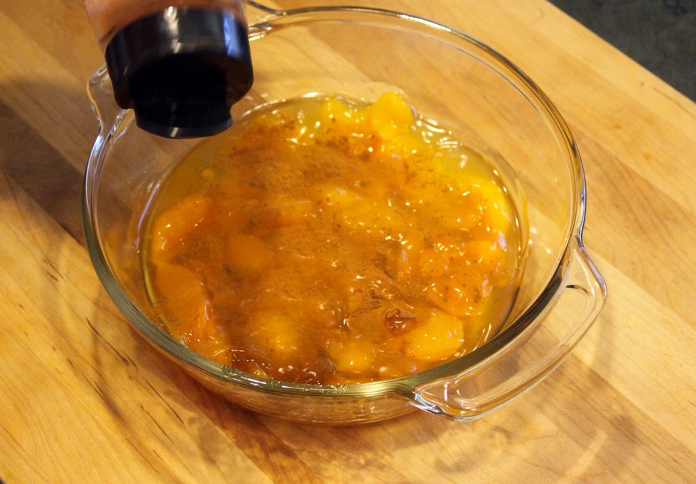 Sprinkle half of the cinnamon on the peaches.