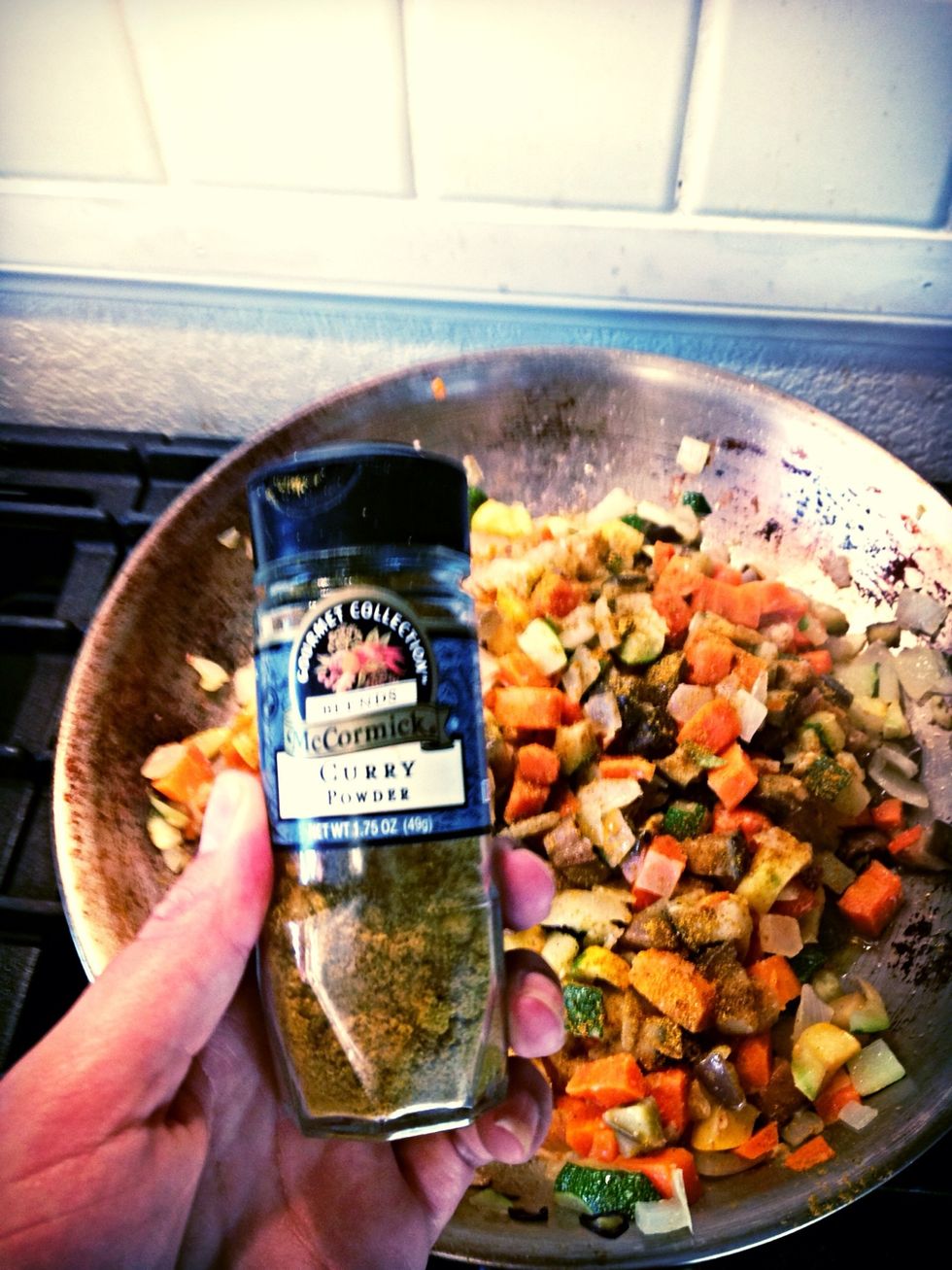 Sprinkle in 2 tbsp of curry powder and a dash of salt.