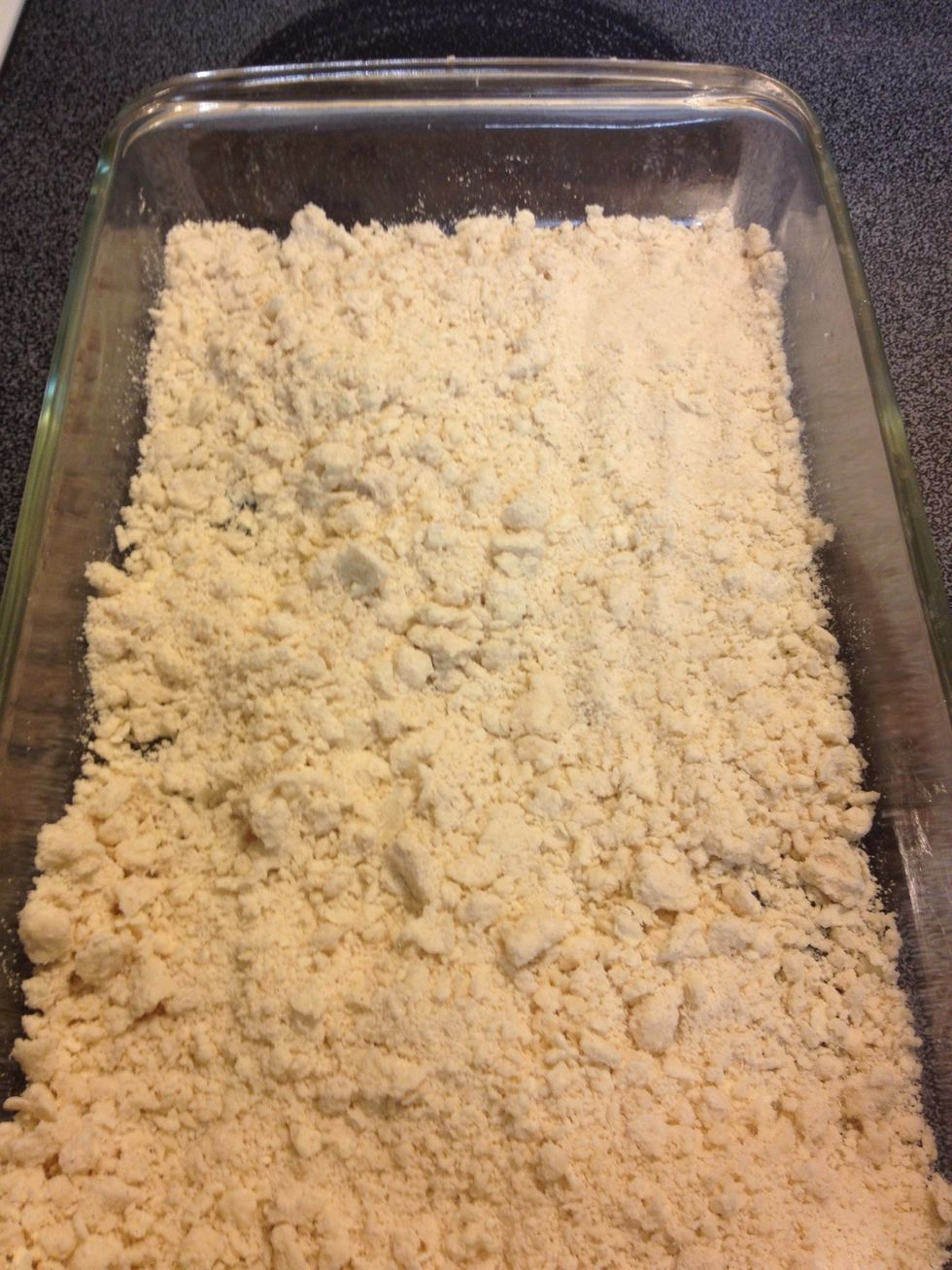 Sprinkle it mixture all over the base of a baking dish, and press down into place.