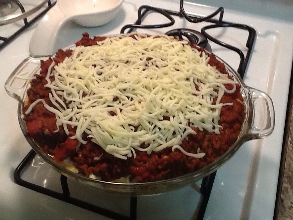 Sprinkle mozzarella cheese over the top of the pie then bake for 5-7 minutes longer, until cheese melts.