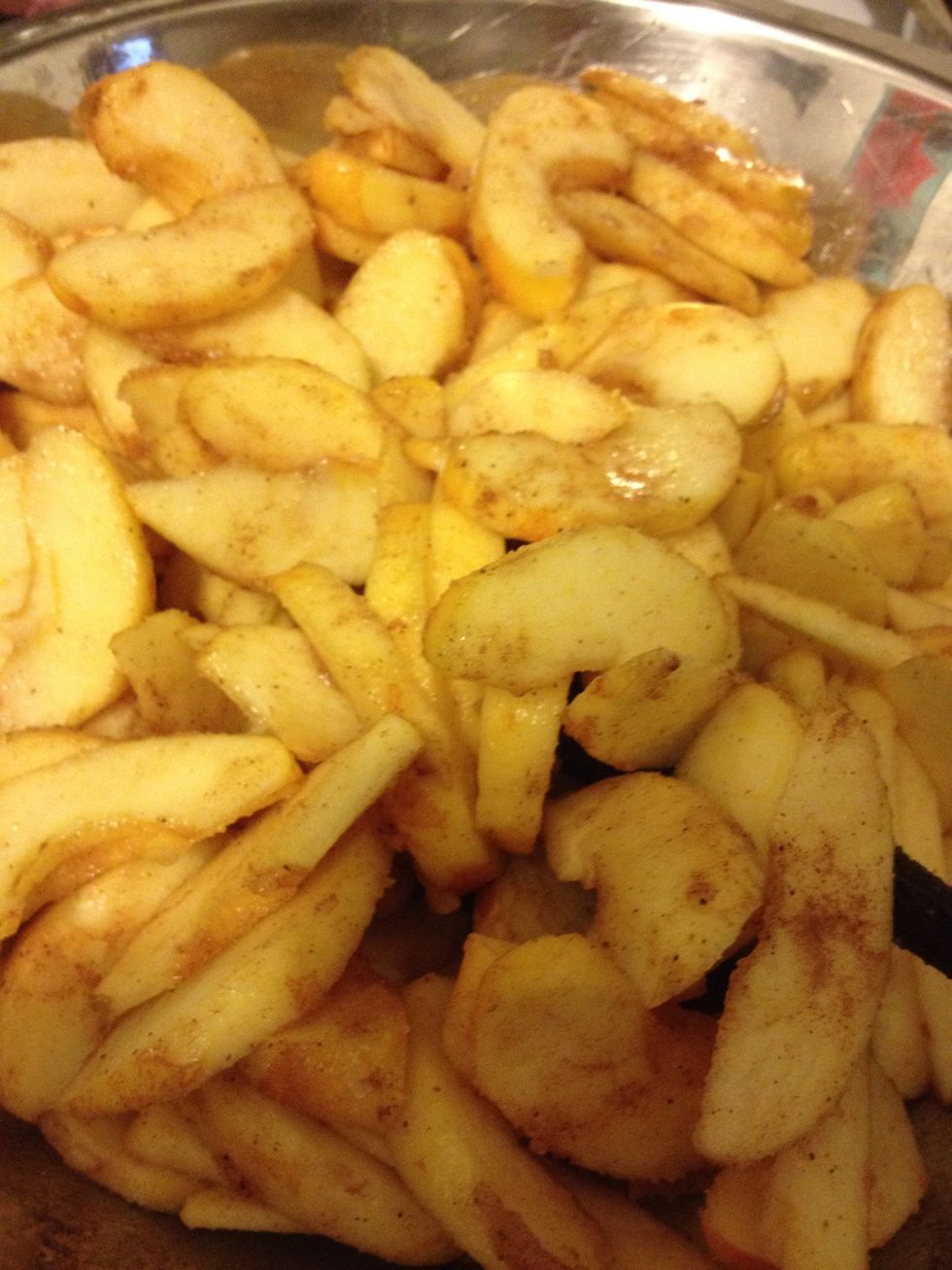 Sprinkle on spices and other 1/4 cup of sugar. I put the apples in the fridge for a few minutes. They made a little juice so I tossed them a bit.