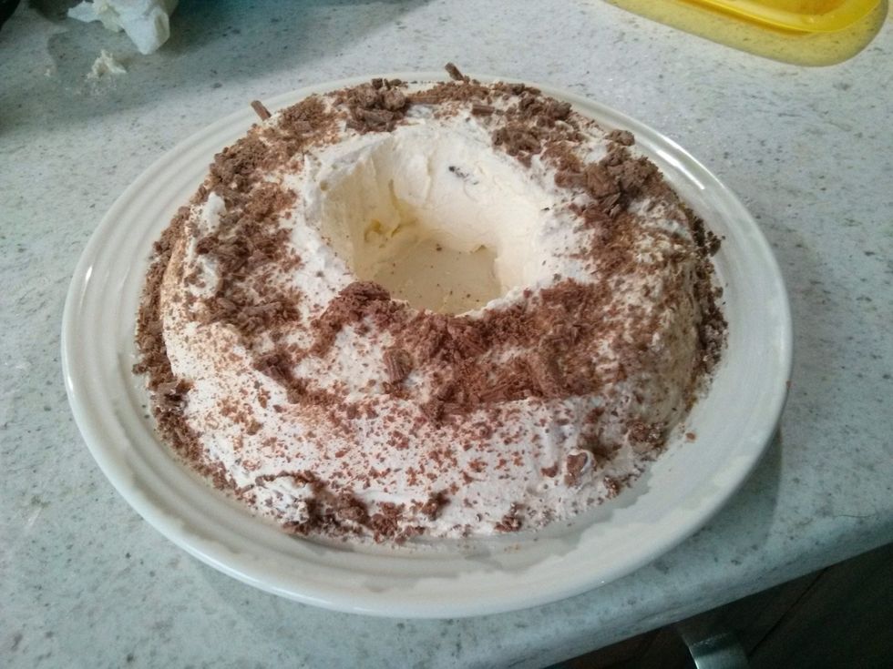 Sprinkle on the flakey chocolate. Clean the outside of the plate.