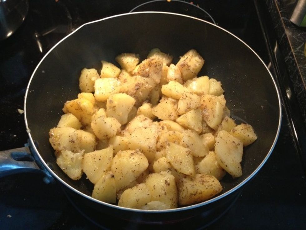 Sprinkle one and half teaspoon salt and one table spoon black pepper. Toss by hand instead of stirring so that potatoes don't break. Add more salt and pepper to taste.