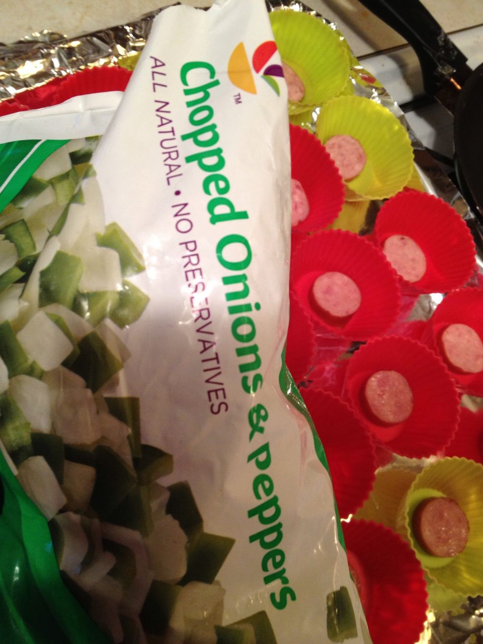 sprinkle onions and peppers on each muffin tin