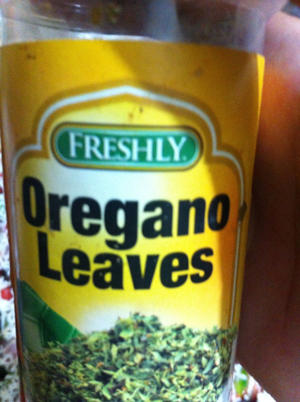 Sprinkle oregano leaves. It's aroma works up your appetite for pizza. Pop your pizza in pre-heated oven for 35-40 min
