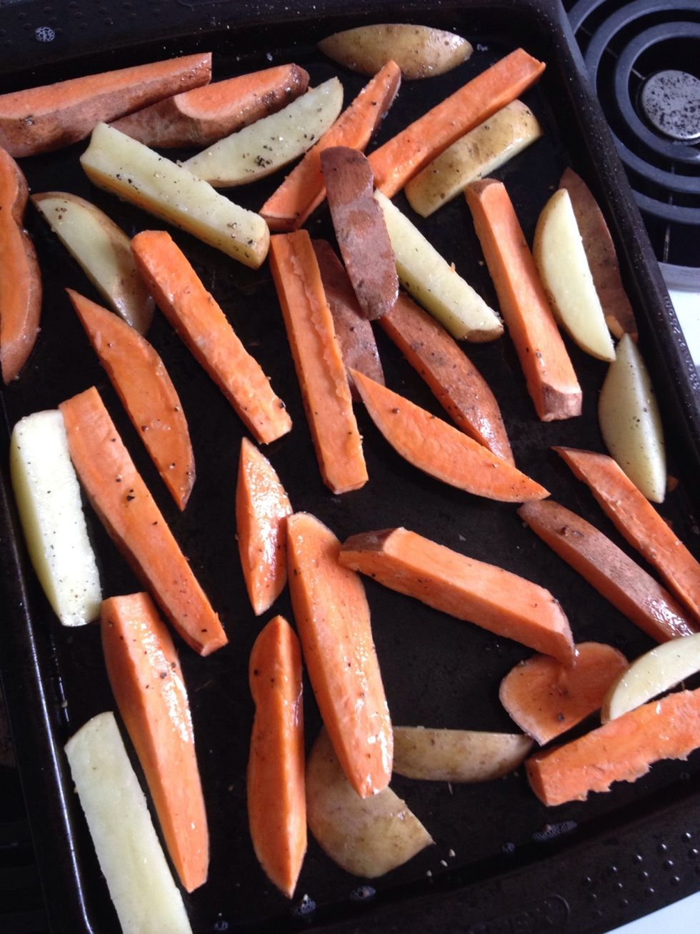 Sprinkle over the salt and pepper. Space them out well, this is important as if they are too close they will take a long time to cook. Now it's time to put them in the oven!