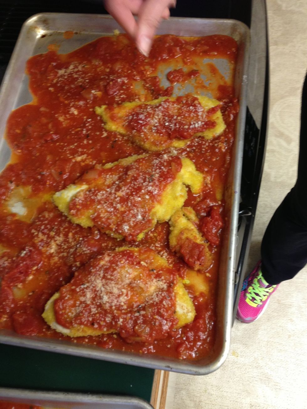 Sprinkle Parmesan on the chicken
