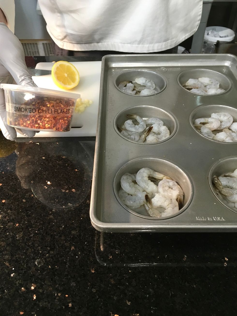 Sprinkle red chili flakes (to taste) over the shrimp.