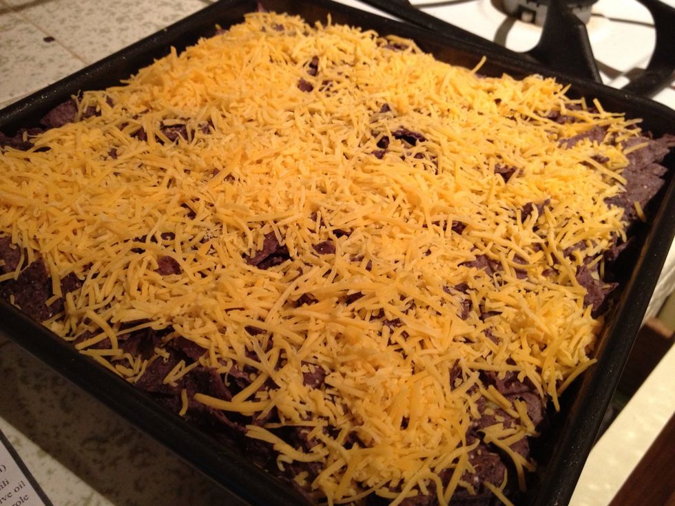 Sprinkle remaining cheese on top and place in oven to bake for 30 minutes or until cheese is golden and bubbly.