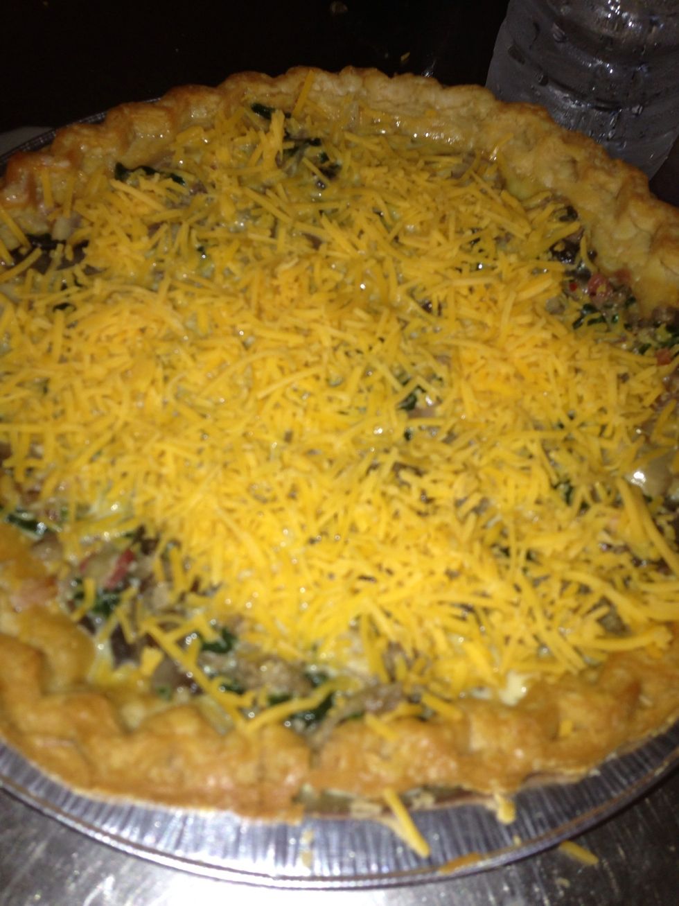 Sprinkle remaining cheese over quiche