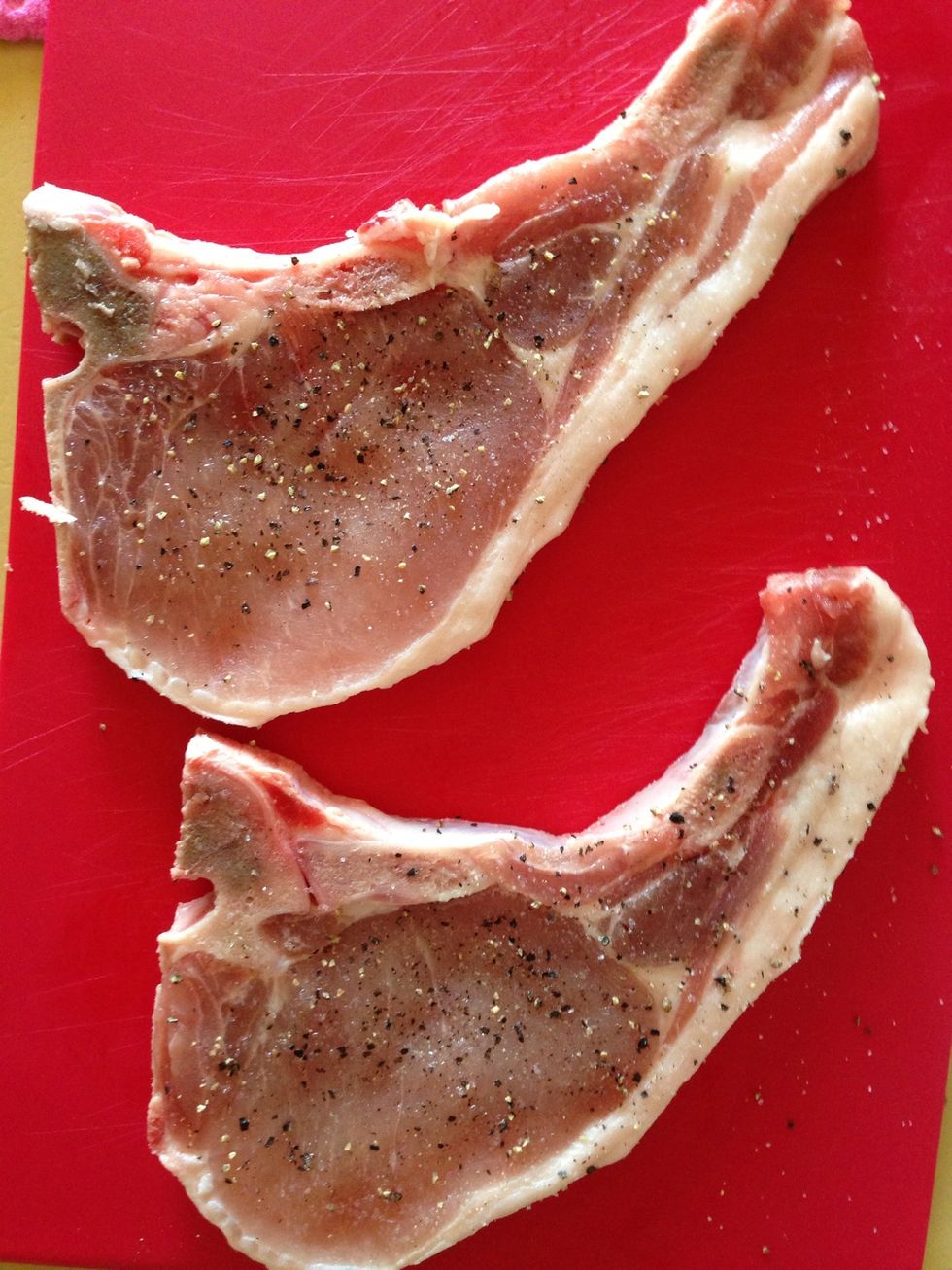 Sprinkle salt and pepper on both sides of the pork chop and rub it in. Cook until these are golden on both sides. I used no oil. Just hot pan on a medium flame and covered as they cooked.