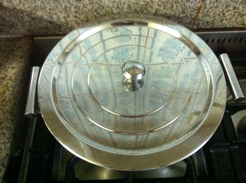 Sprinkle salt over the tomatoes and cover the pot and let the tomatoes cook over low heat for 5 minutes