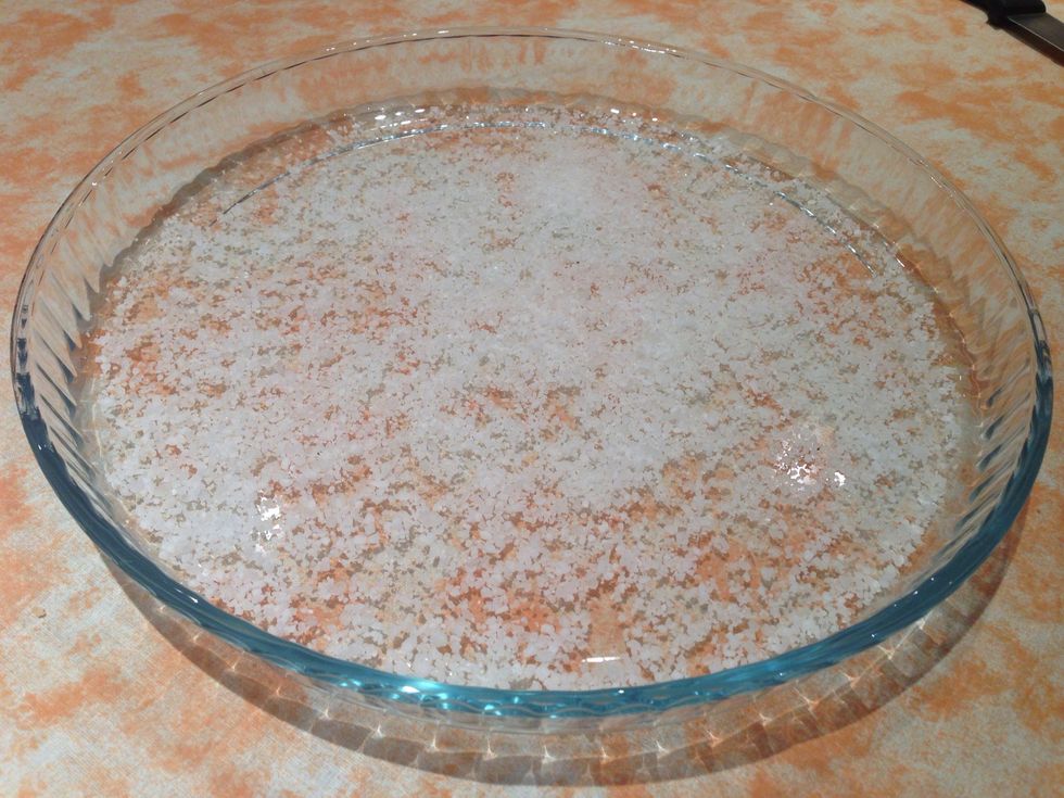 Sprinkle sea salt all over an oven-ready tray.