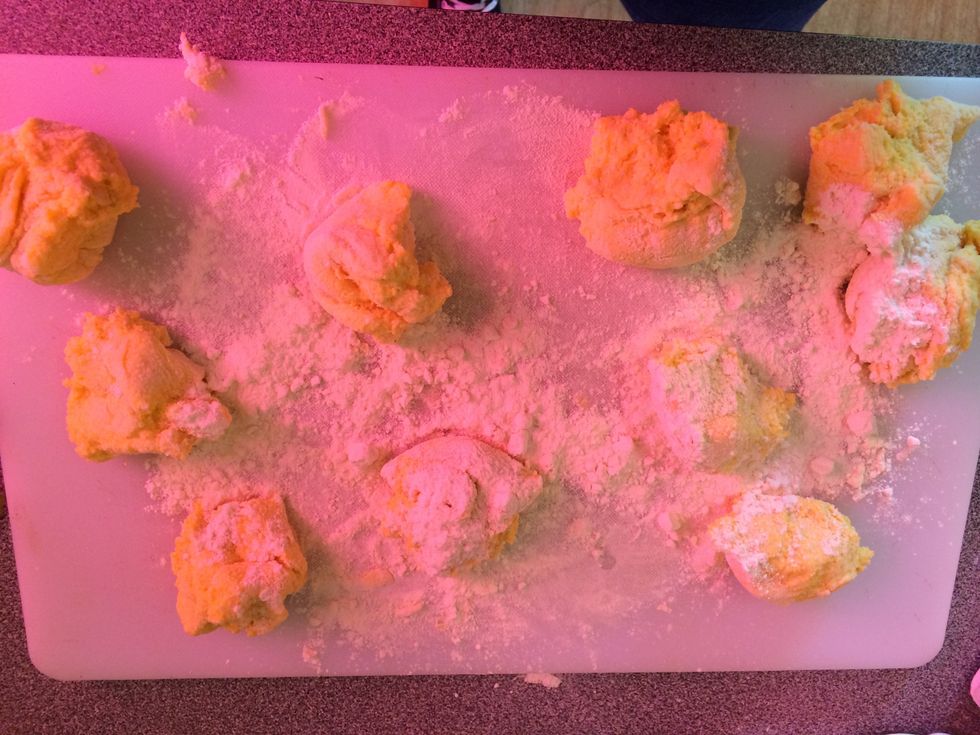 Sprinkle some flour over the pieces and roll the pieces into a ball.