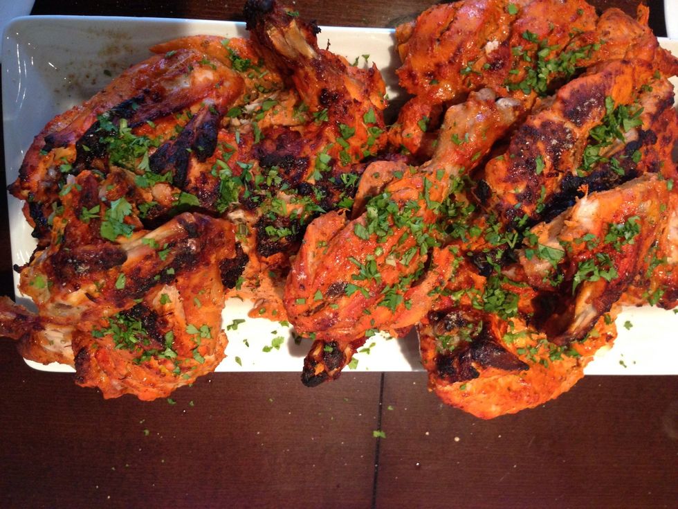 Sprinkle some more chaat masala on top and squeeze another half a lemon on top.