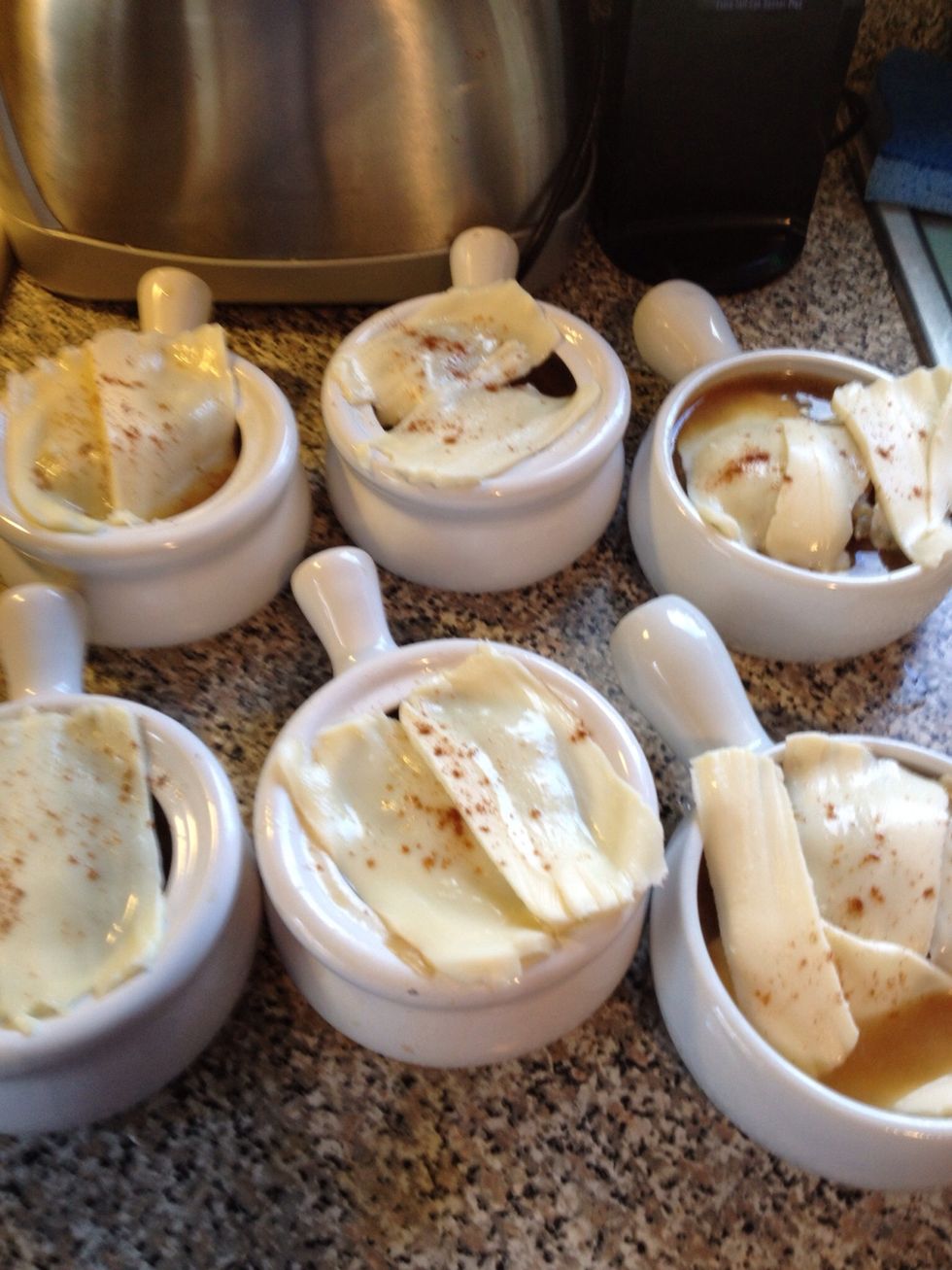 Sprinkle some paprika on cheese (Optional). Then place in oven on broil to melt cheese. Keep a very close eye on soup so you don't burn the cheese.