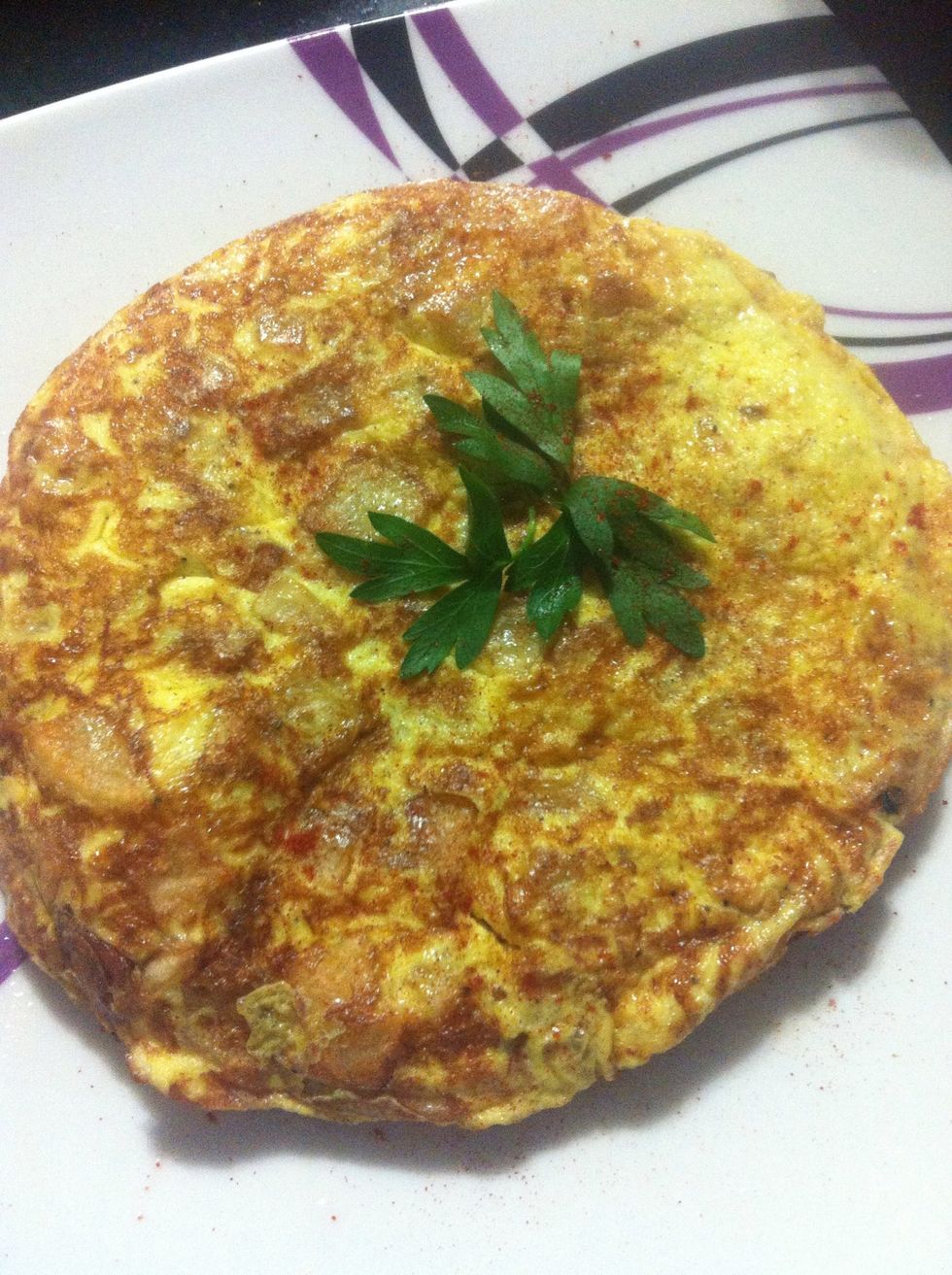 Sprinkle some paprika on top and decorate with parsley.