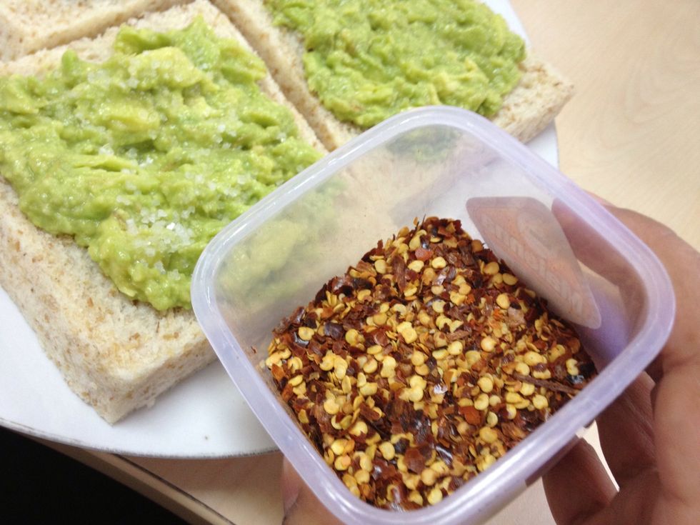 Sprinkle some peperoncino to a slice that has been sprinkled with salt