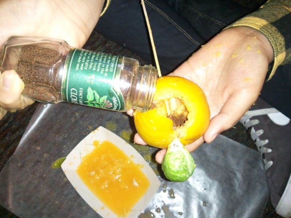 Sprinkle spices inside the empty cavity.  Any spice will do.  I like cloves because they make the Pharaoh smell good and help to brown the mummy as the resin did in ancient Egypt.