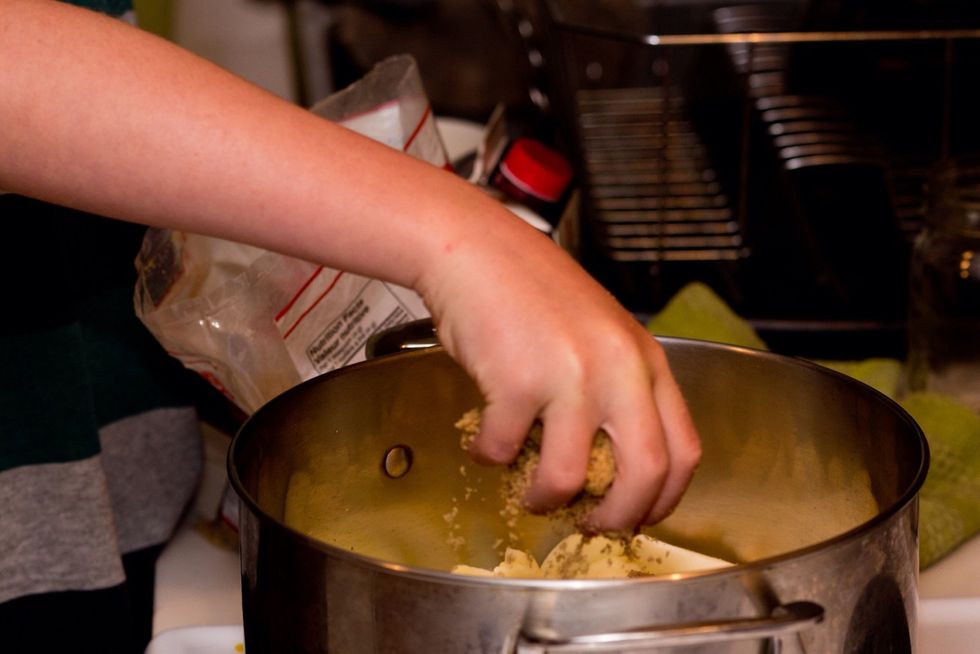 Sprinkle sugar over the top of all the apples. It's fun to grab a handful of sugar. Cleaning it off my hands with my tongue was fun too. Dad made me wash my hands after though.