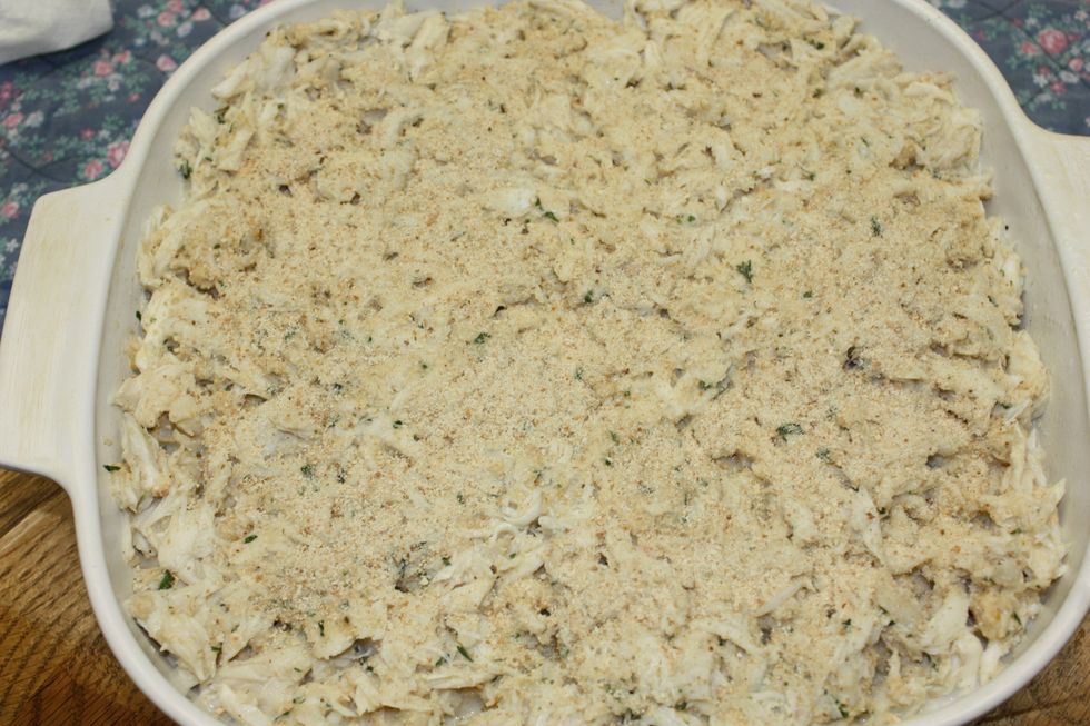 Sprinkle the breadcrumbs on top of the crab.