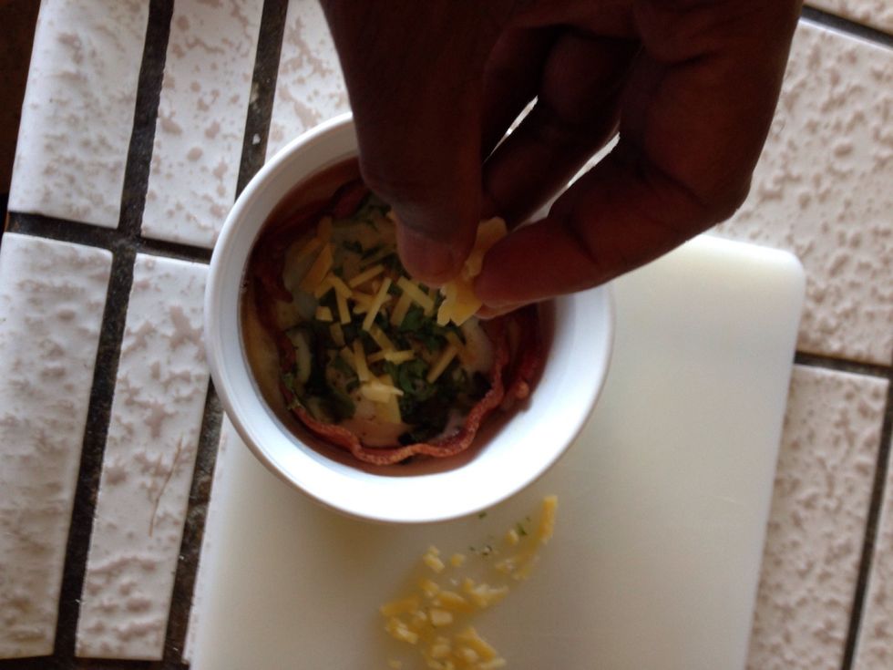 Sprinkle the cheese over the baked eggs from the oven...