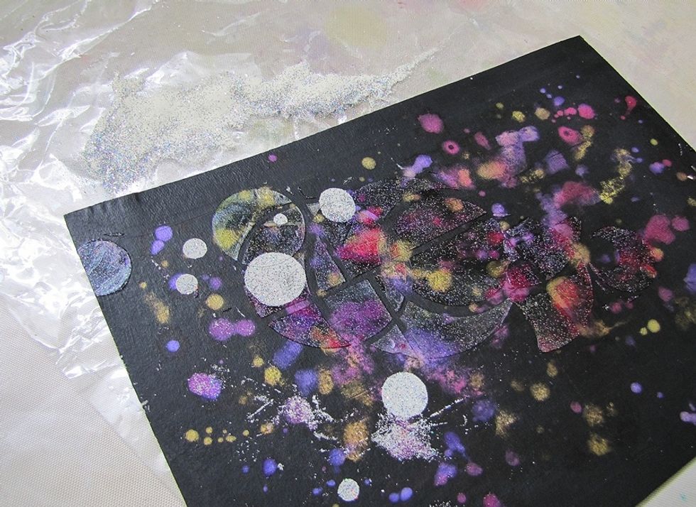 Sprinkle the circles with embossing powder and heat it.