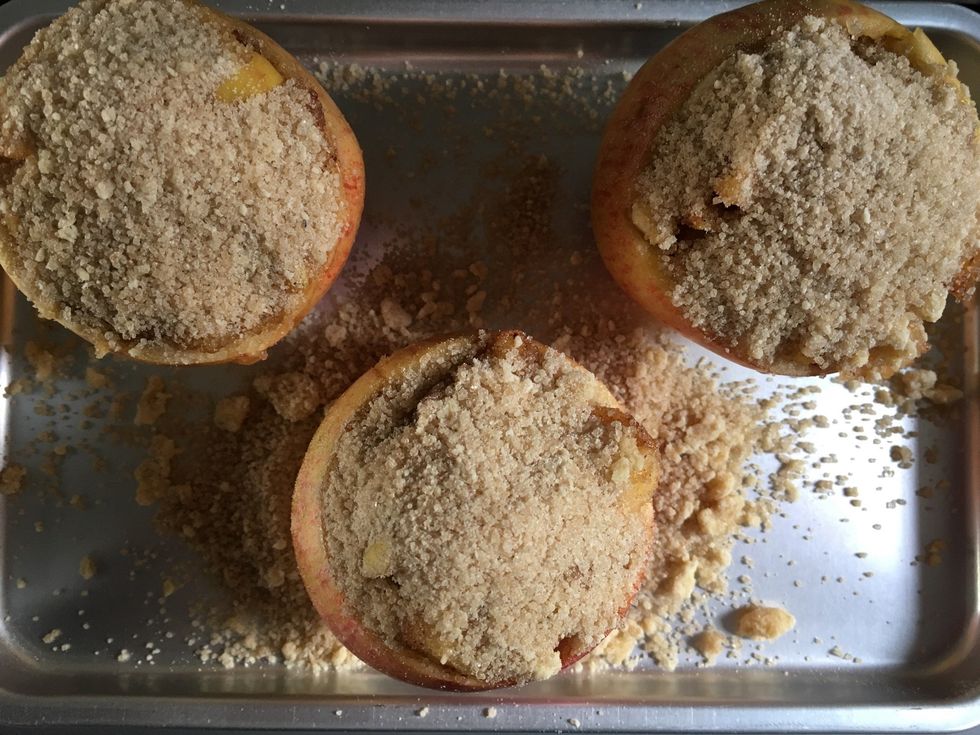 Sprinkle the flour, brown sugar and butter mixture over the apples.