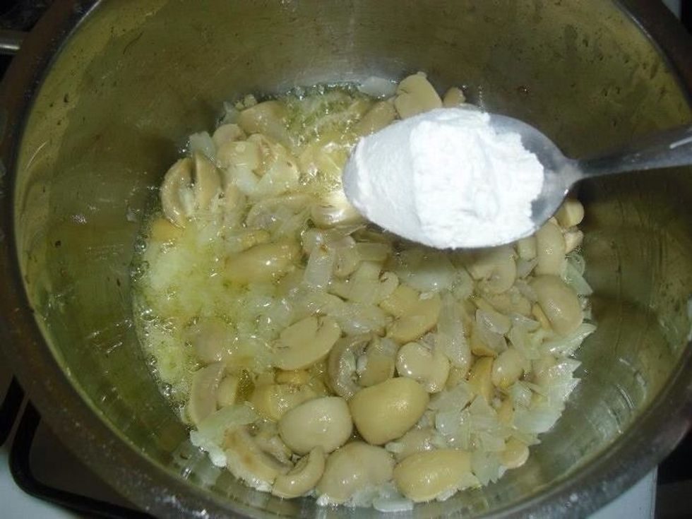 Sprinkle the flour over the mushrooms, mix well to combine.